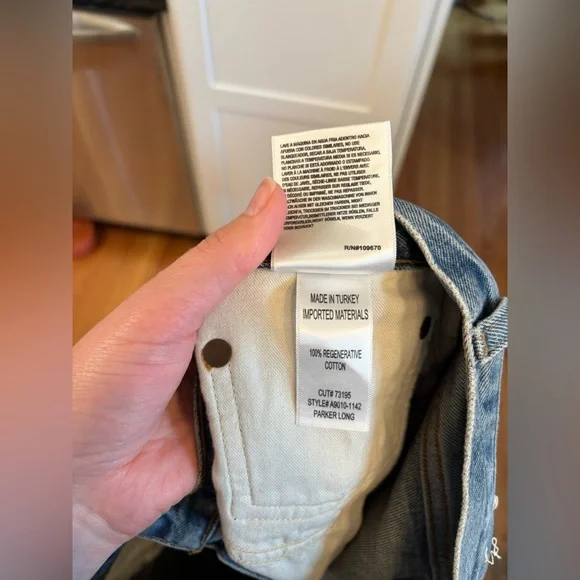 new Agolde Parker long denim shorts in Skywave medium light wash